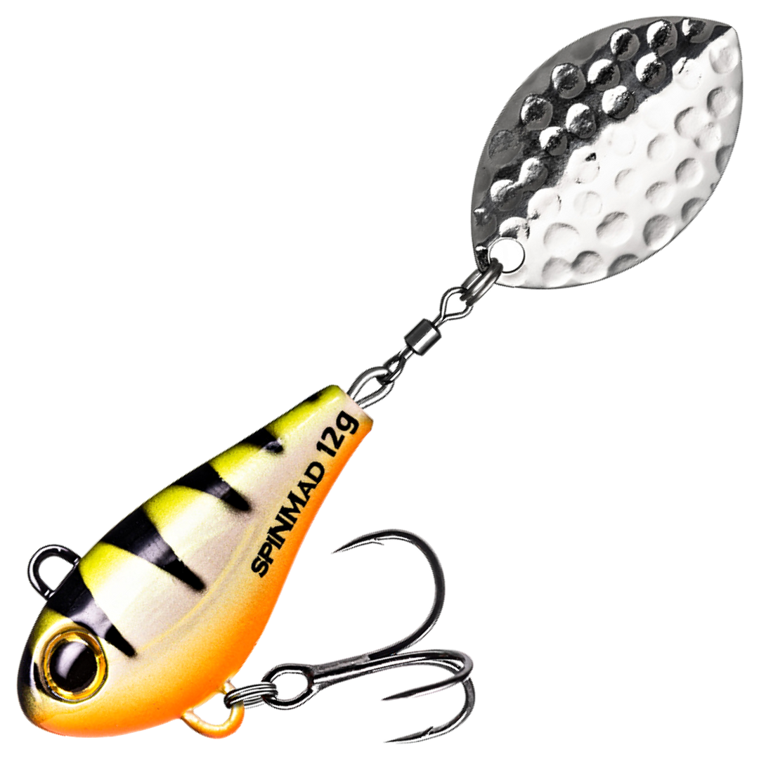 Spinmad Jigmaster Spintail 12g, väri 1401: keltavalkoinen runko, mustat raidat, oranssi vatsa ja hopeinen lippa