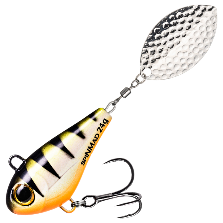 Spinmad Jigmaster Spintail 24g, väri 1501: keltavalkoinen runko, mustat raidat, oranssi vatsa ja hopeinen lippa